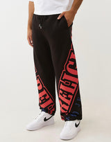 TRUE RELIGION OVERT ARCH LOGO BAGGY JOGGER (JET BLACK/RED)