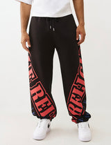TRUE RELIGION OVERT ARCH LOGO BAGGY JOGGER (JET BLACK/RED)