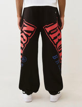 TRUE RELIGION OVERT ARCH LOGO BAGGY JOGGER (JET BLACK/RED)